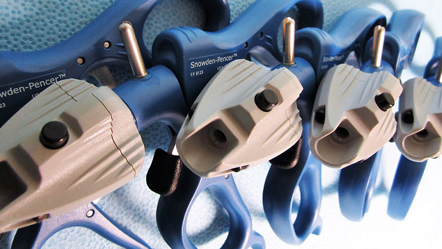 Five laparoscopic instruments laying partially on top of each other